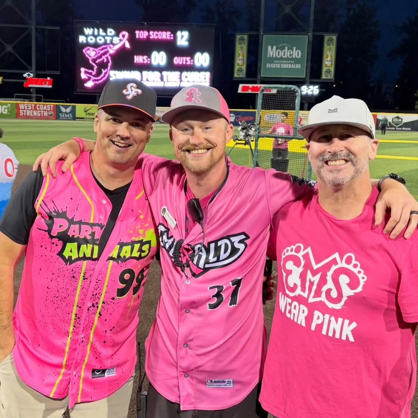Men Wear Pink ambassadors in pink jerseys at Eugene Emeralds Swing for the Cure night